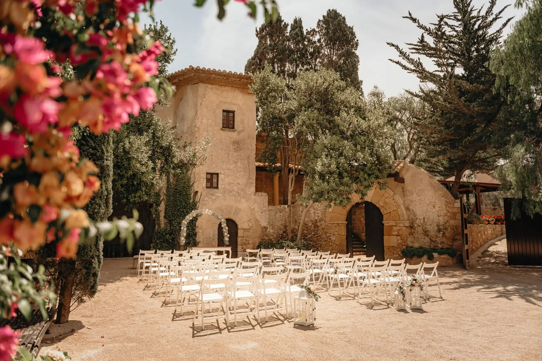 Bougainvillea in bloom over the prepared Patio de Armas