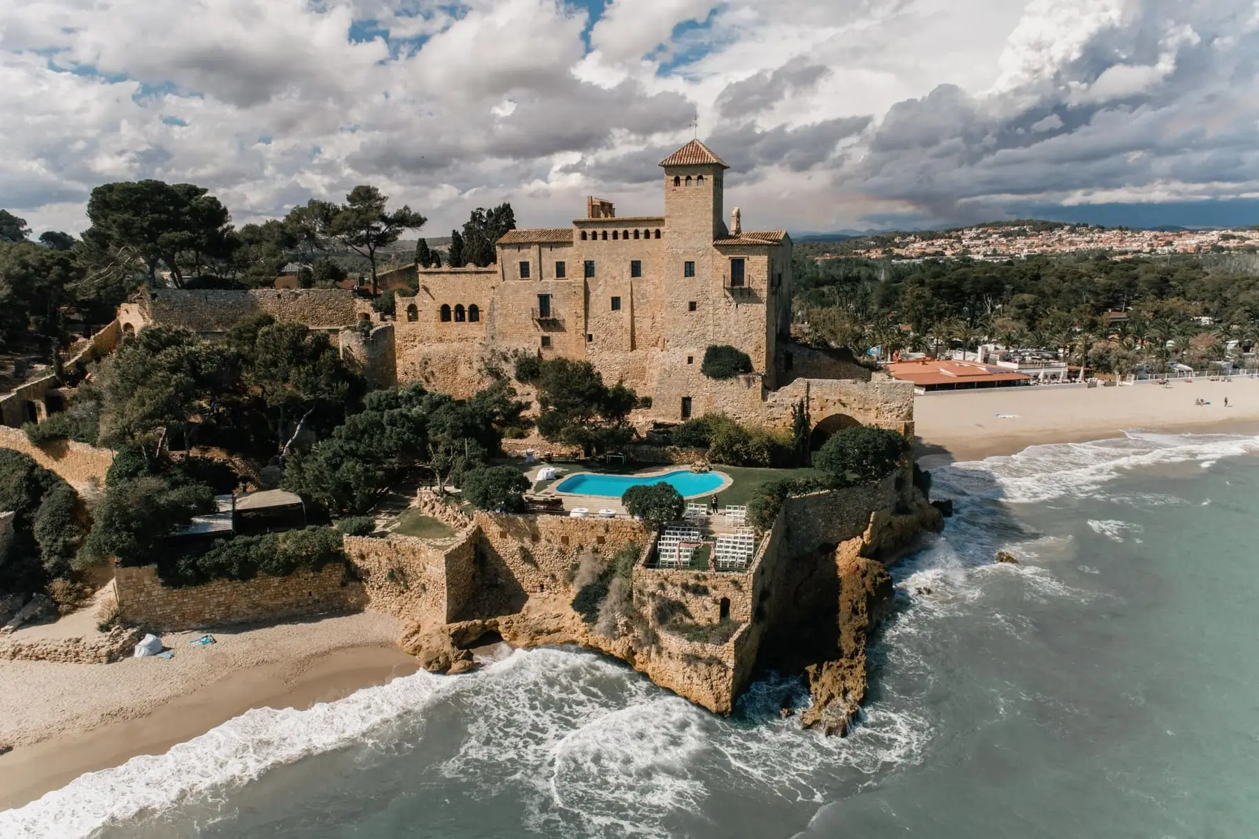 Aerial view of Tamarit Castle showing the tower, the pool, the Mirador, the pine grove and the beach
